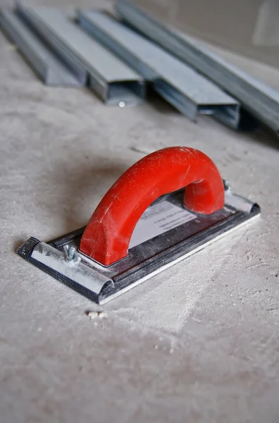 Drywall Contractors' Tool with red handle